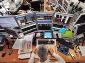 trader lunch front computers screens August 2011 office French investment company Aurel Paris. Global stocks tumbled further safe gold surged records mounting fears fresh g...